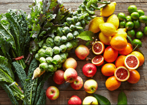 a group of fruits and vegetables on a wood surface Healthy Weight Loss Diets Smethwick