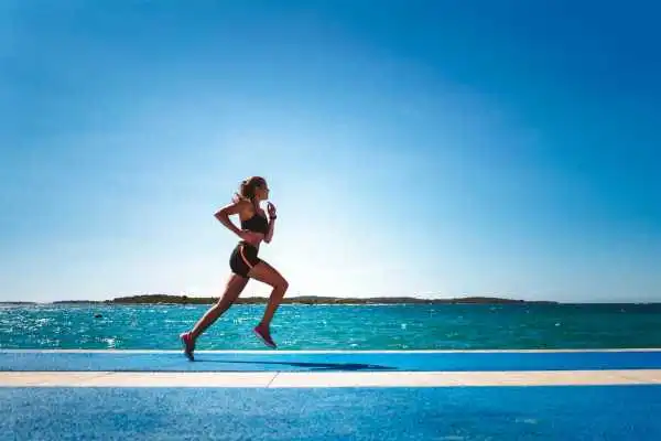 Woman running showing strong leg muscle Smethwick